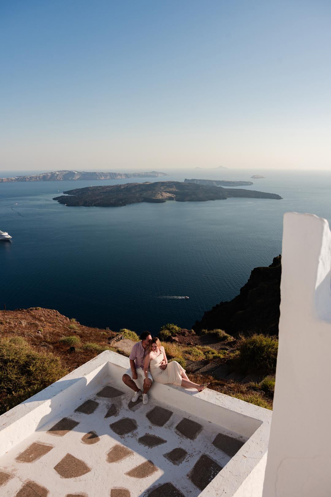 Looking across white terrace rooftops to Nea Kameni from high on the caldera rim