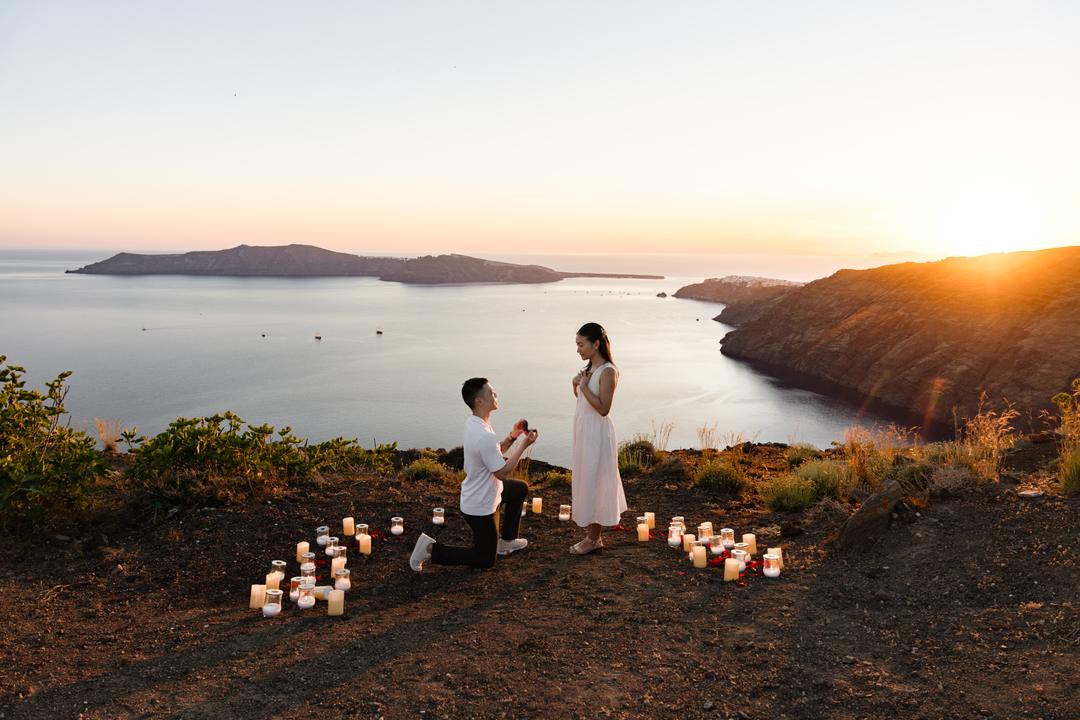 A proposal inside a circle of candles on an empty stretch of ridge