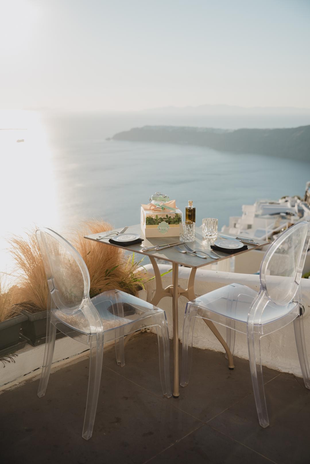 A dressed dinner table with pampas styling waiting above the caldera before golden hour