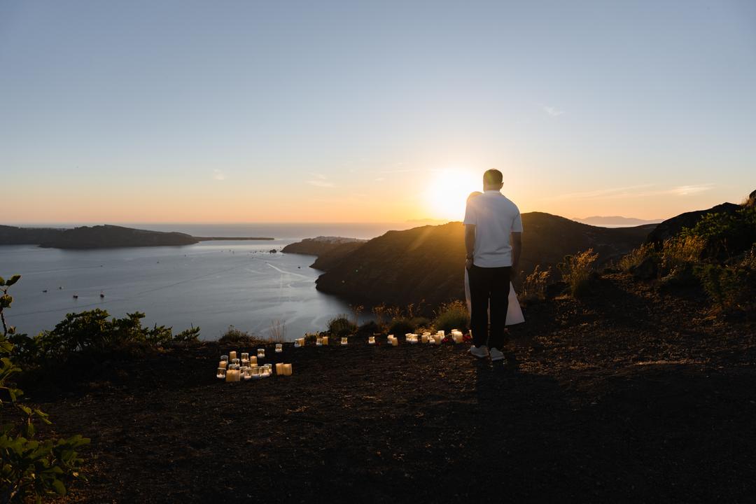 The mouth of the caldera at golden hour in spring, candles set out and waiting